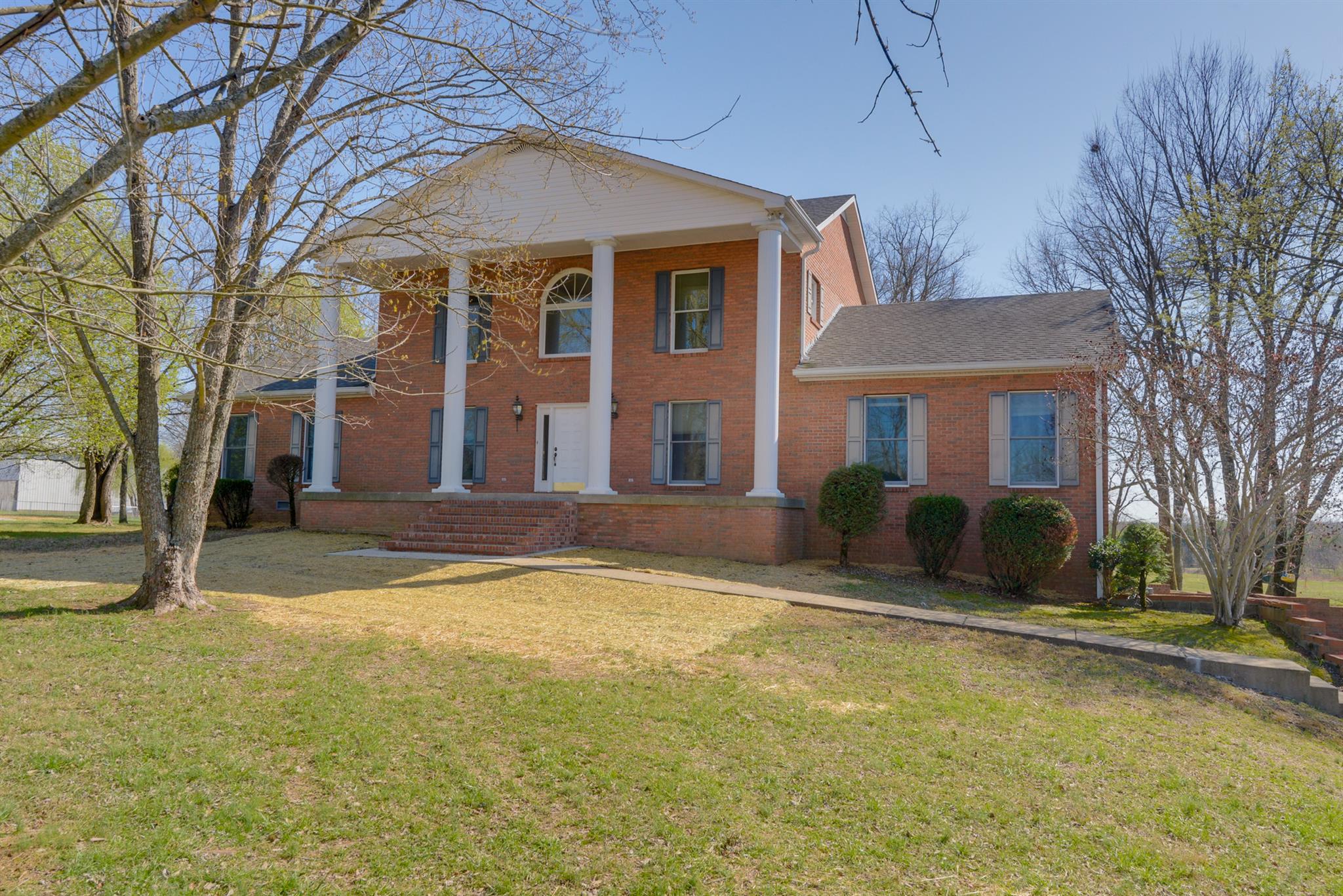 320 Goshen Road Lebanon, TN 37087 - Photo 25 of 28 a view of a brick house with a large trees