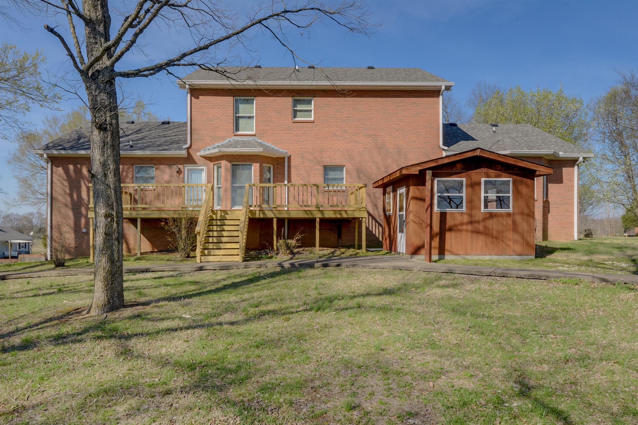 320 Goshen Road Lebanon, TN 37087 - Photo 3 of 28 a front view of a house with a garden