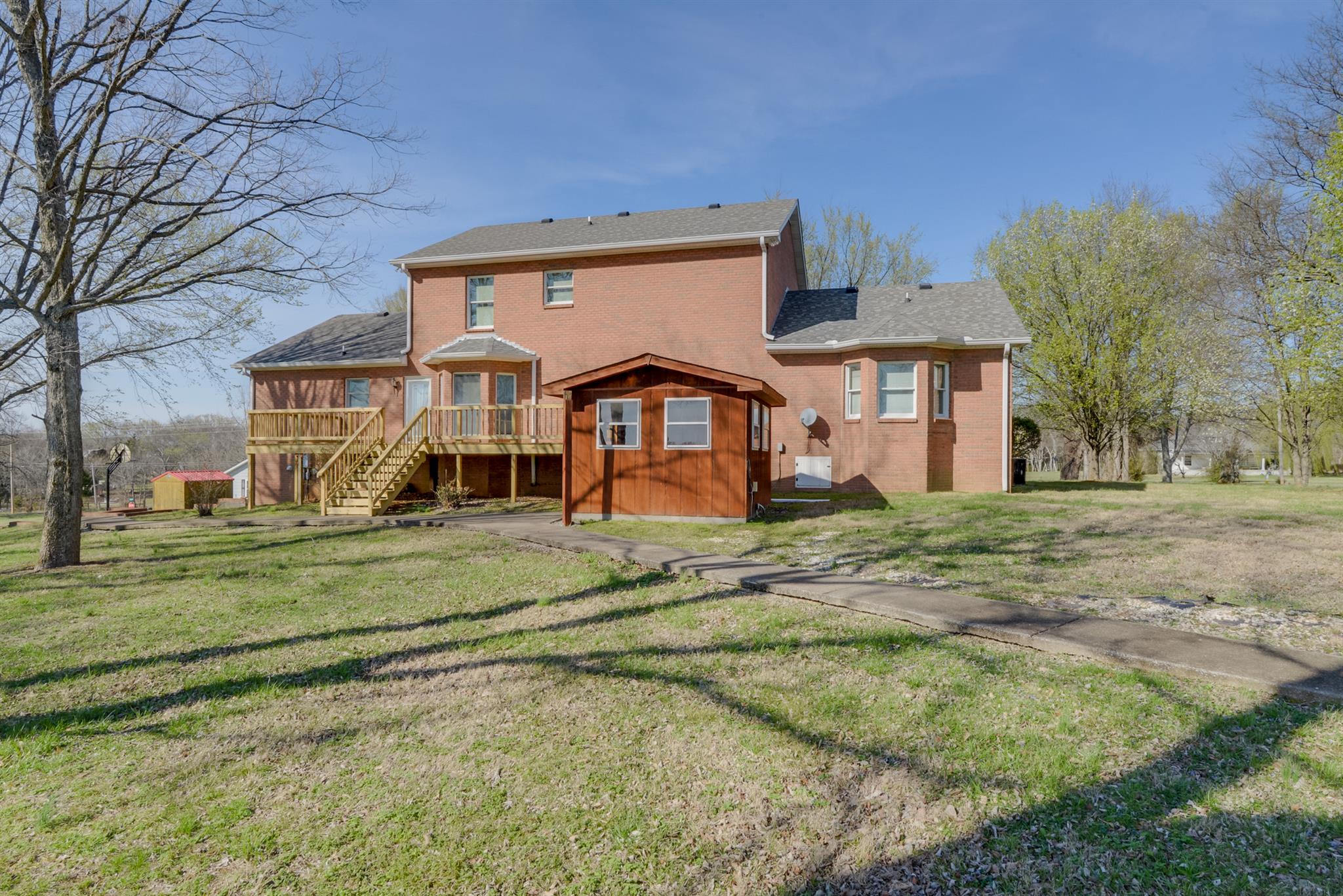 320 Goshen Road Lebanon, TN 37087 - Photo 4 of 28 a front view of a house with a yard