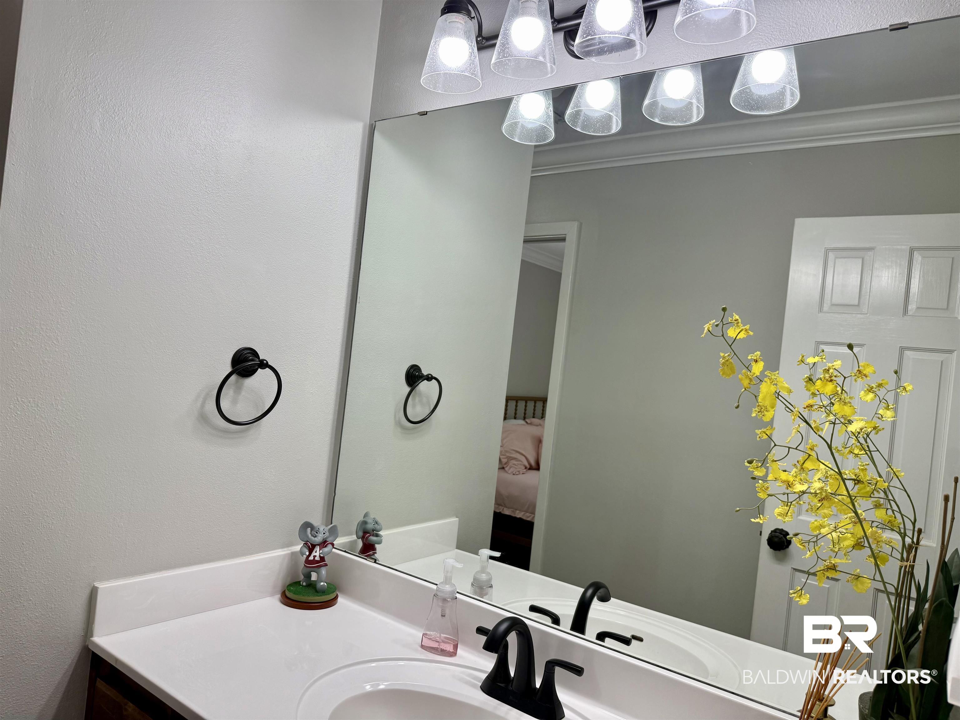 5646 Foshee Road Brewton, AL 36426 - Photo 21 of 37 Bathroom featuring vanity, ensuite bathroom, and ornamental molding