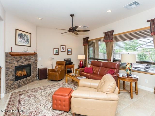 1636 Constable Street Prescott, AZ 86301 - Photo 12 of 33 a living room with furniture a fireplace and a large window