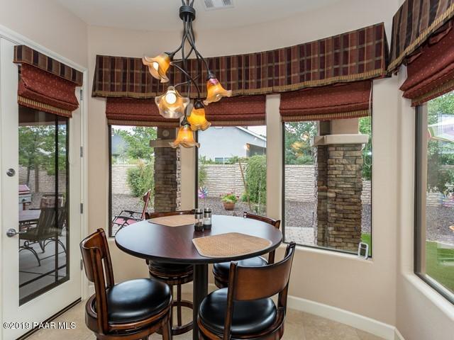1636 Constable Street Prescott, AZ 86301 - Photo 16 of 33 a dining room with furniture a chandelier and window