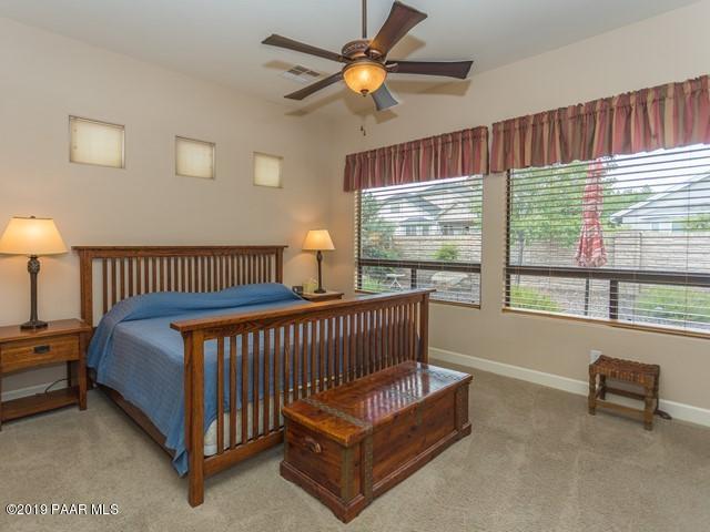 1636 Constable Street Prescott, AZ 86301 - Photo 17 of 33 a bed sitting in a bedroom next to a window