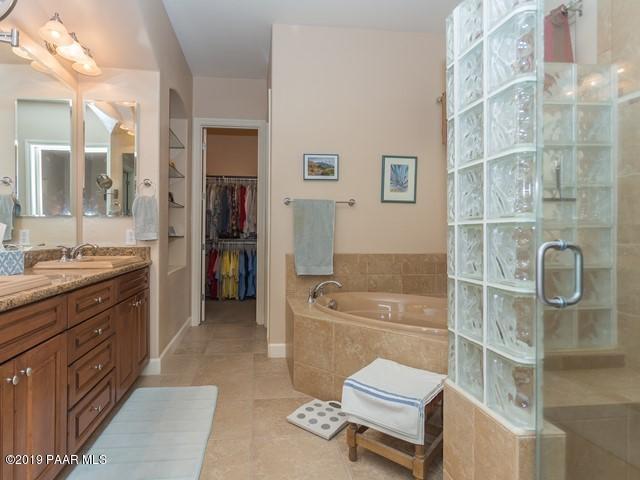 1636 Constable Street Prescott, AZ 86301 - Photo 18 of 33 a bathroom with a granite countertop sink a toilet and shower