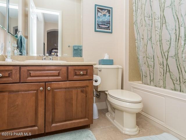 1636 Constable Street Prescott, AZ 86301 - Photo 22 of 33 a bathroom with a sink a toilet and a mirror