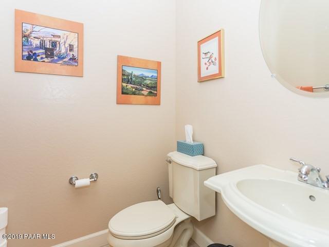 1636 Constable Street Prescott, AZ 86301 - Photo 24 of 33 a white toilet sitting next to a bathroom sink