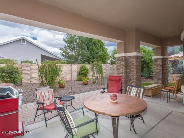 1636 Constable Street Prescott, AZ 86301 - Photo 27 of 33 a backyard of a house with a table and chairs