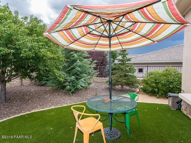 1636 Constable Street Prescott, AZ 86301 - Photo 28 of 33 a backyard of a house with table and chairs