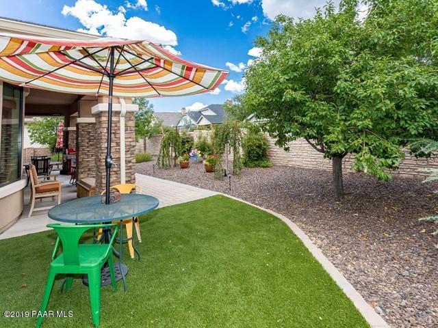 1636 Constable Street Prescott, AZ 86301 - Photo 29 of 33 a view of a patio with a table and chairs under an umbrella
