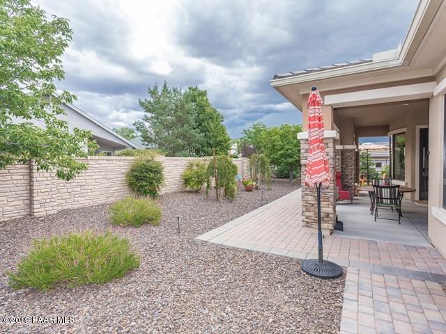 1636 Constable Street Prescott, AZ 86301 - Photo 31 of 33 a view of a house with backyard porch and sitting area