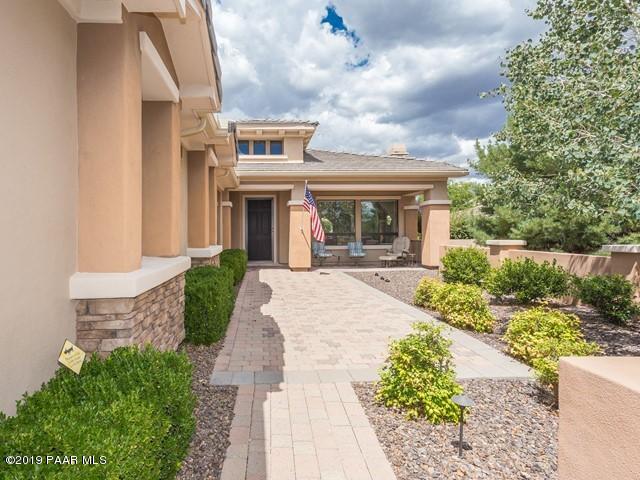 1636 Constable Street Prescott, AZ 86301 - Photo 4 of 33 a front view of a house with a garden and plants
