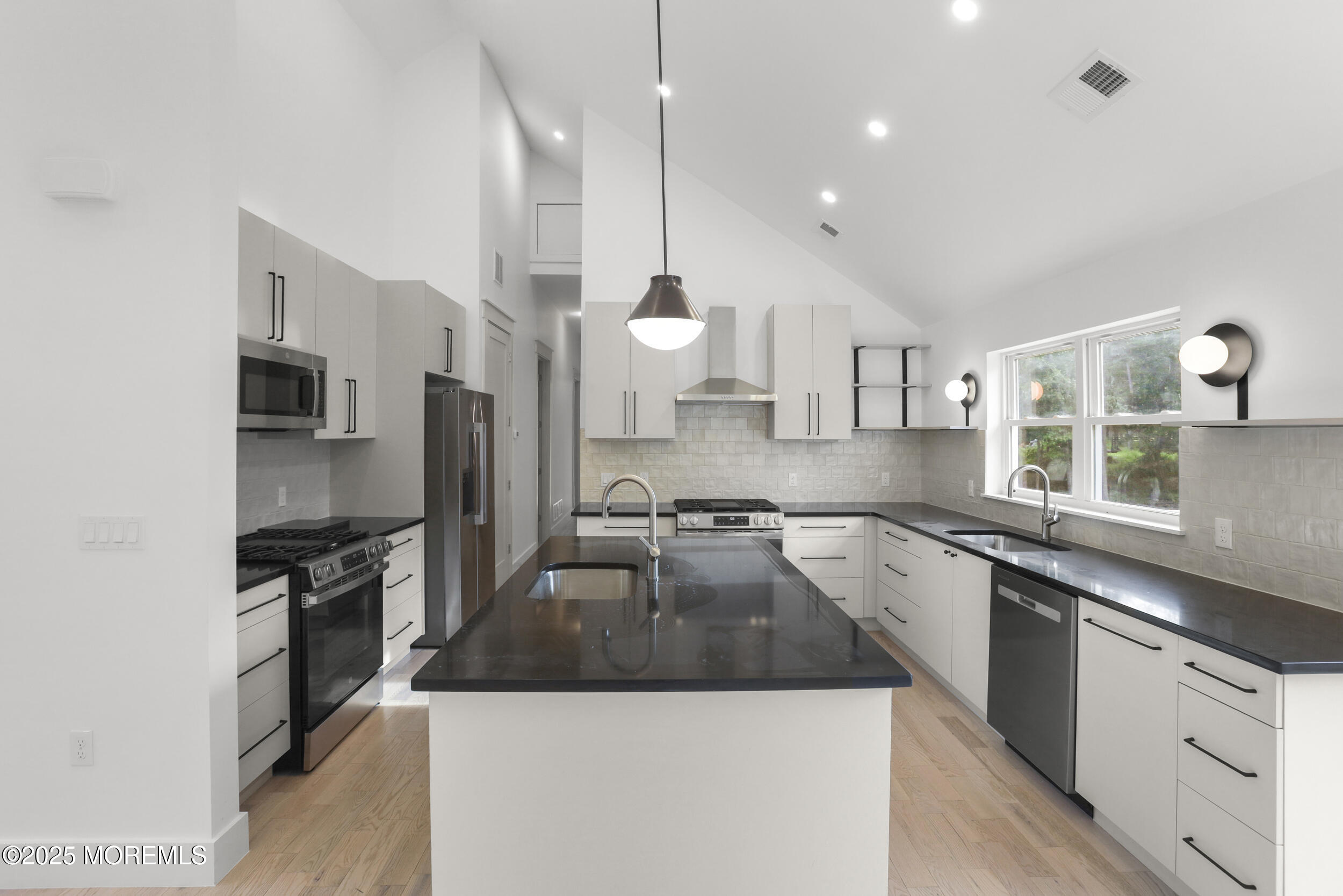 1405 Ridge Avenue Jackson, NJ 08527 - Photo 4 of 29 a kitchen with stainless steel appliances granite countertop a sink a stove and a refrigerator