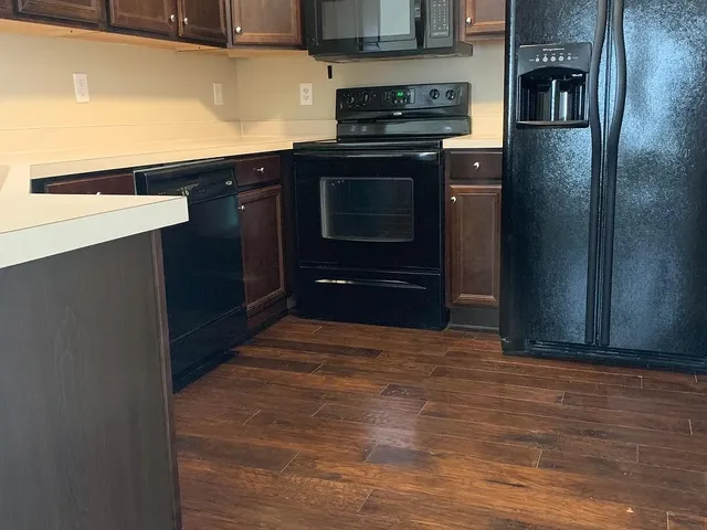 a kitchen with stainless steel appliances a stove and a refrigerator