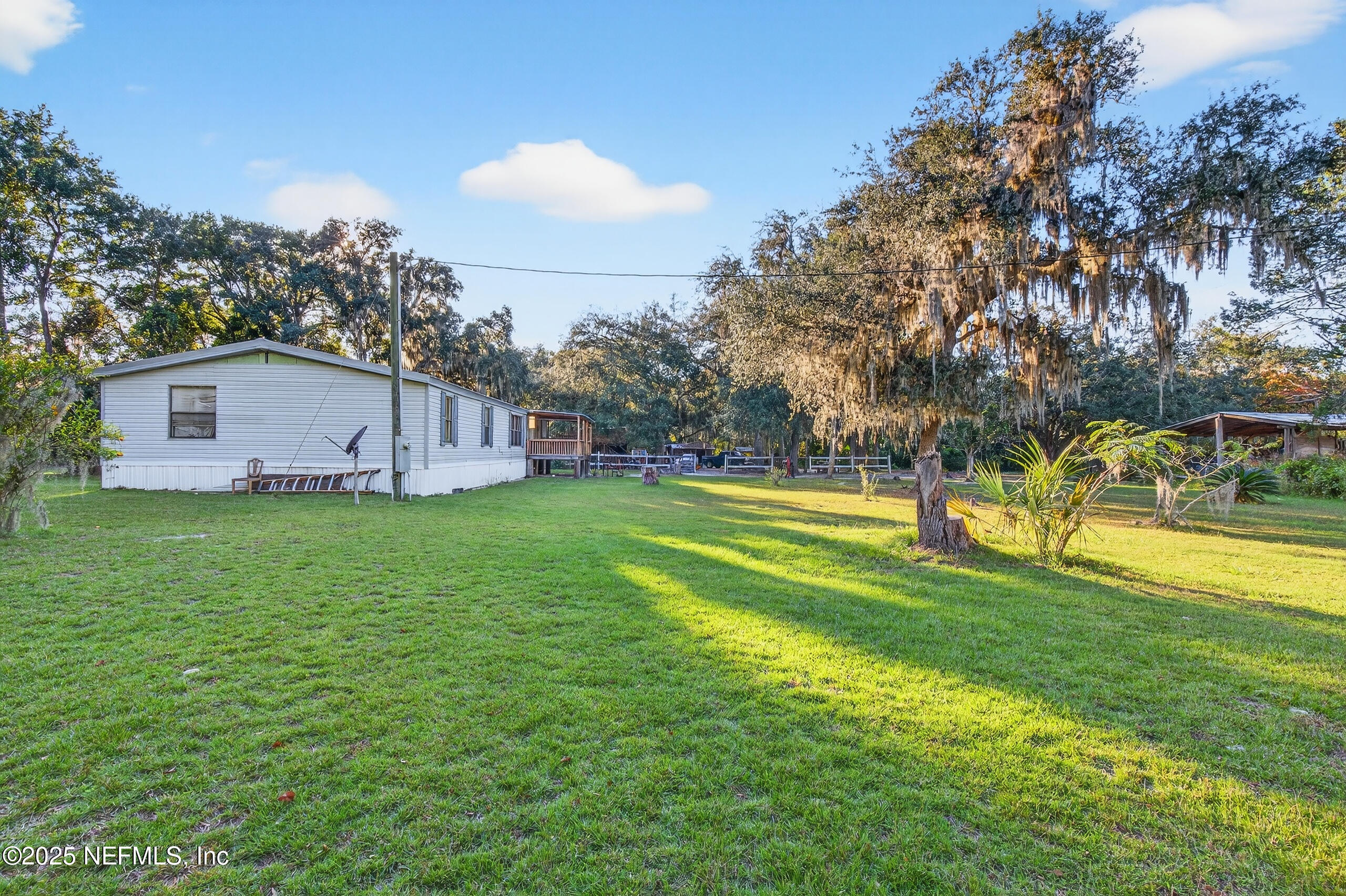 133 Rainbow Road Crescent City, FL 32112 - Photo 13 of 31 a view of a house with a backyard