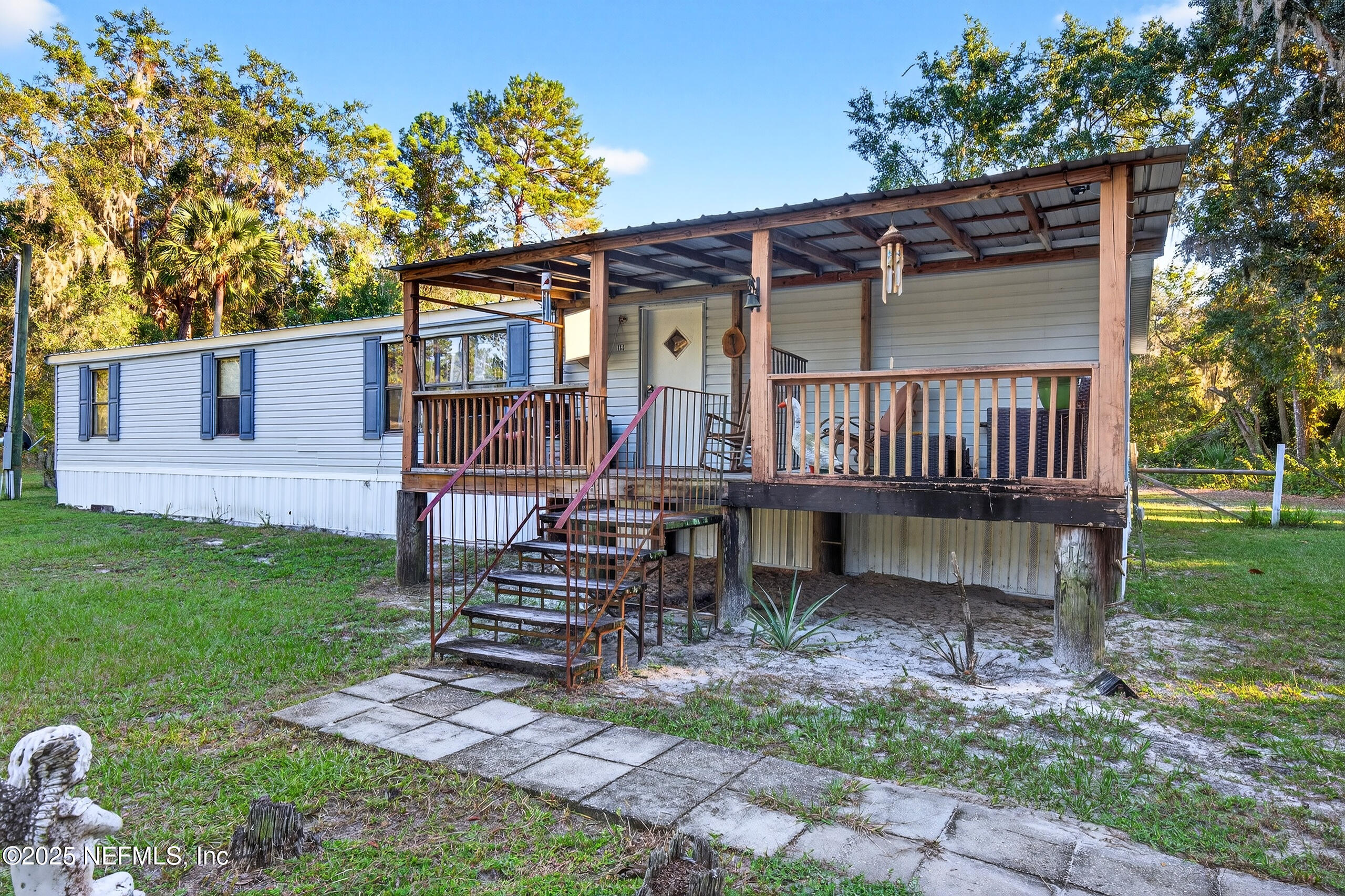 133 Rainbow Road Crescent City, FL 32112 - Photo 14 of 31 front view of a house with a yard
