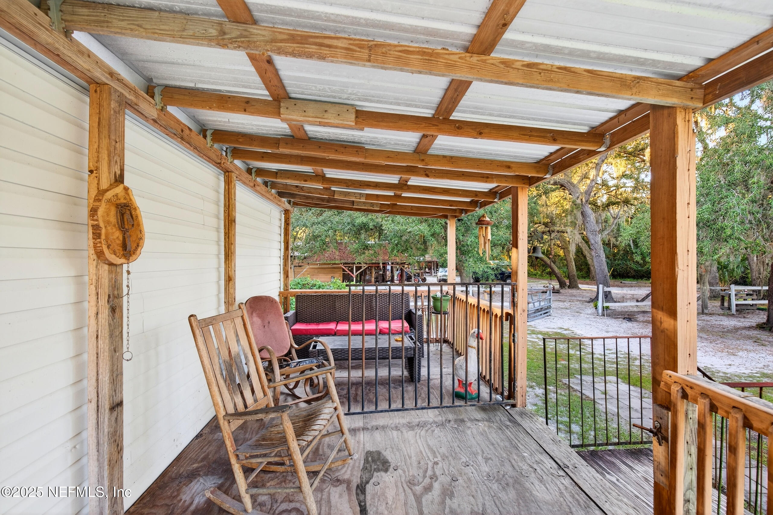 133 Rainbow Road Crescent City, FL 32112 - Photo 15 of 31 a view of porch with a table and chairs