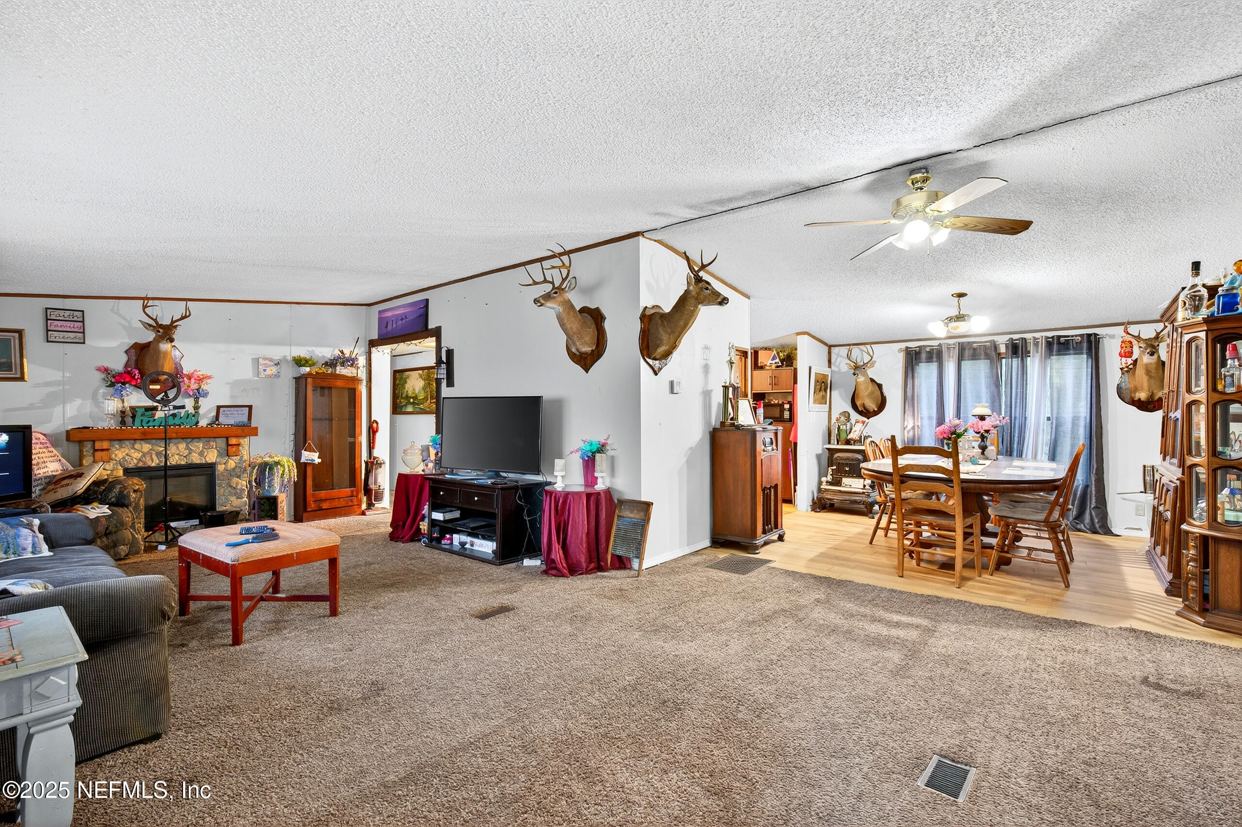 133 Rainbow Road Crescent City, FL 32112 - Photo 16 of 31 a living room with furniture and a flat screen tv