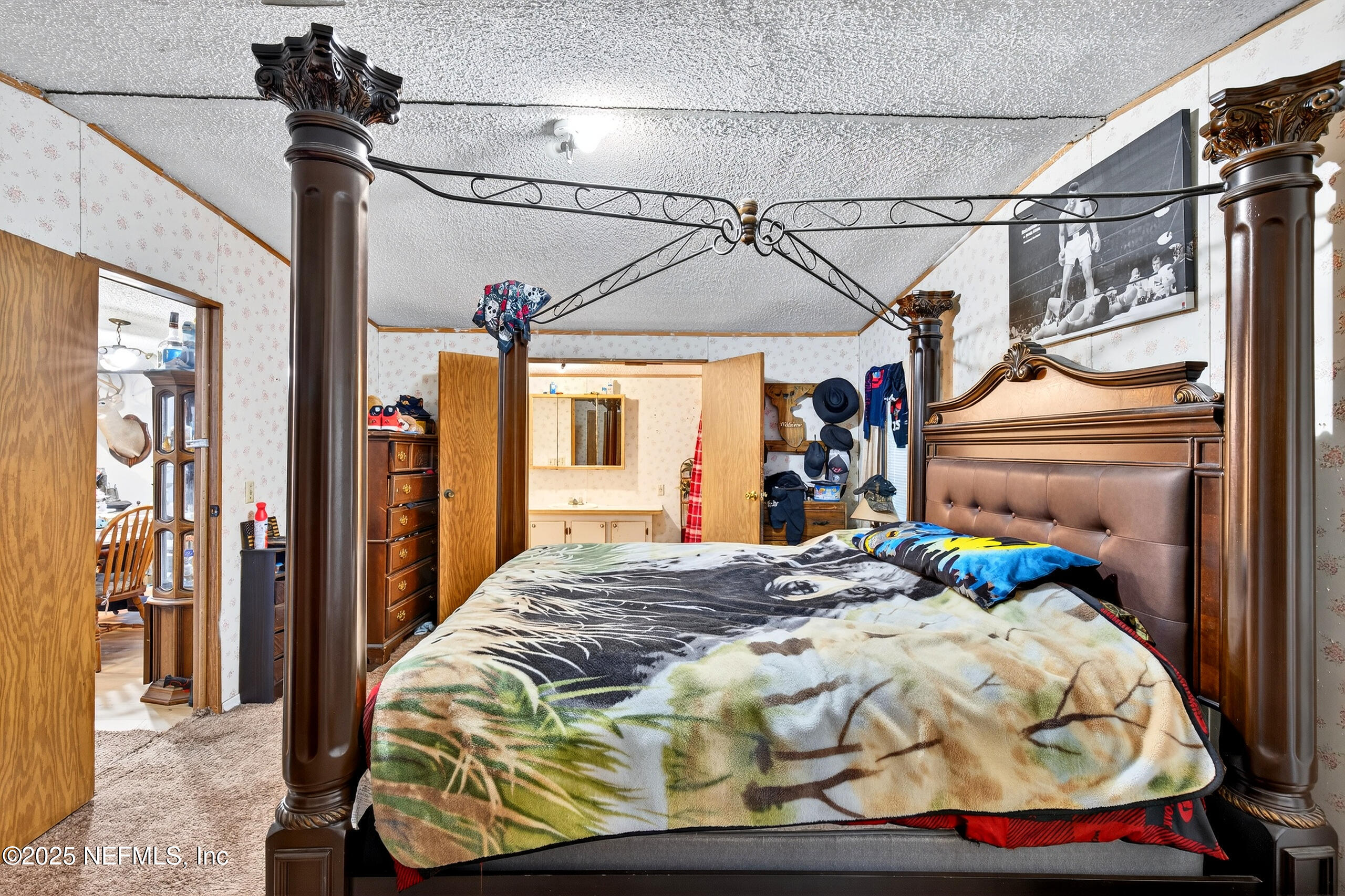 133 Rainbow Road Crescent City, FL 32112 - Photo 25 of 31 a bedroom with a bed and a chandelier