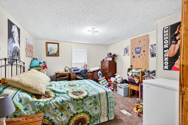 a living room with furniture and storage area