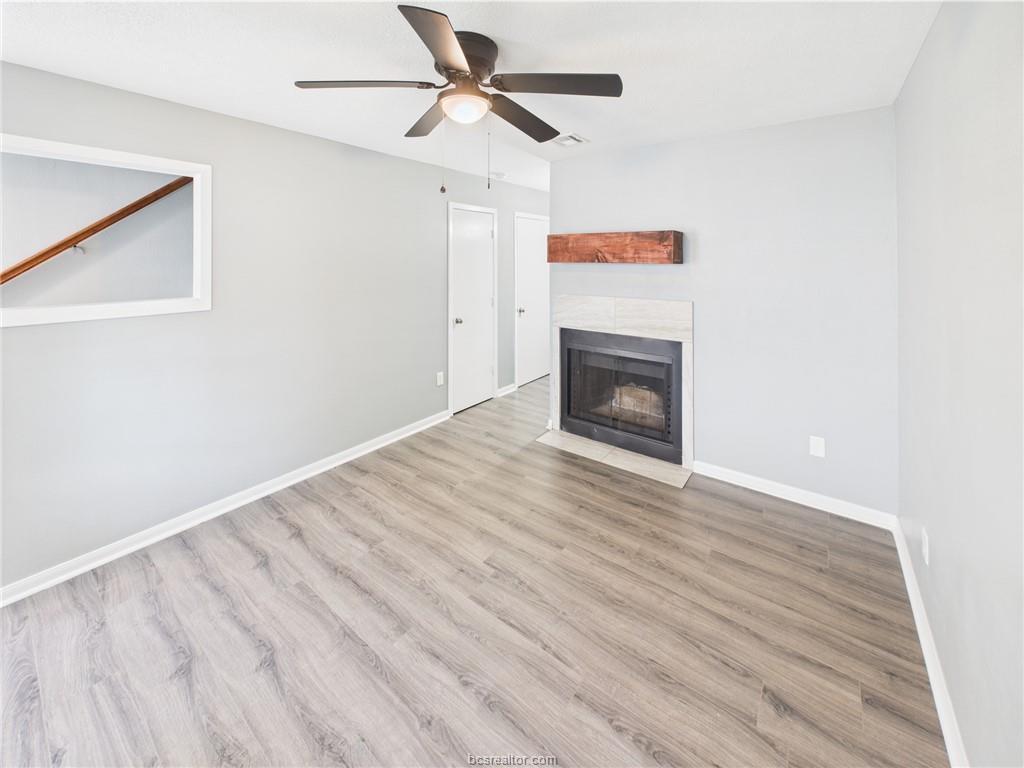 1104 Verde Drive, Unit A Bryan, TX 77801 - Photo 2 of 11 a view of empty room with wooden floor and fireplace