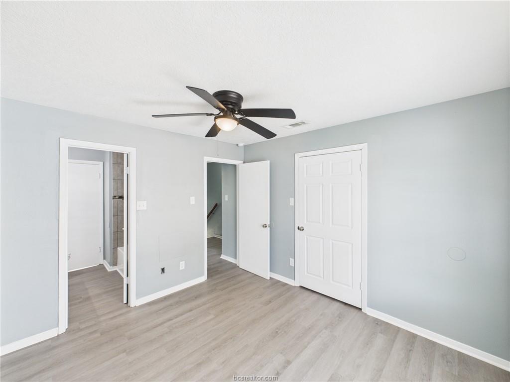 1104 Verde Drive, Unit A Bryan, TX 77801 - Photo 10 of 11 a view of a livingroom with a ceiling fan and wooden floor