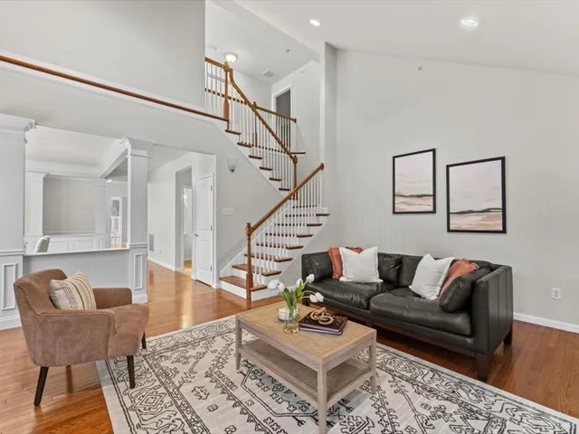 a living room with furniture and a rug