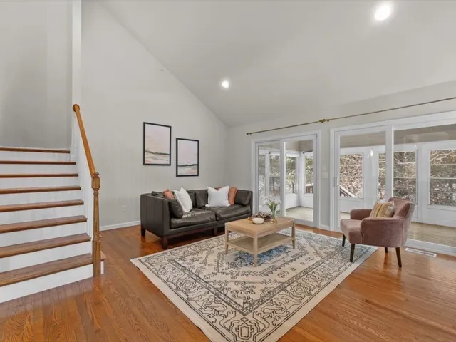 a living room with furniture and a rug