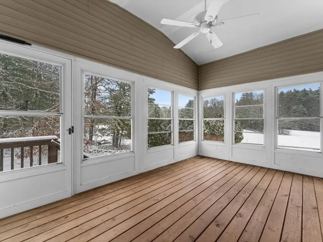 a view of an entryway with wooden floor