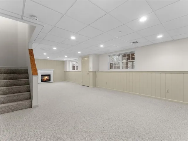 a view of an empty room with a fireplace