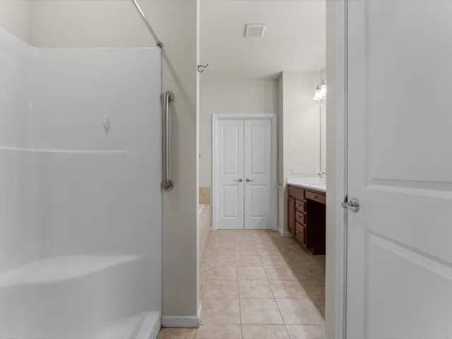 a bathroom with a bathtub and a shower