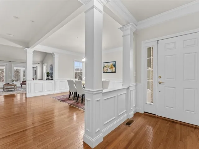 a view of kitchen with furniture and wooden floor