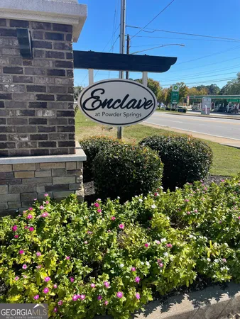 a view of a street with flower plants
