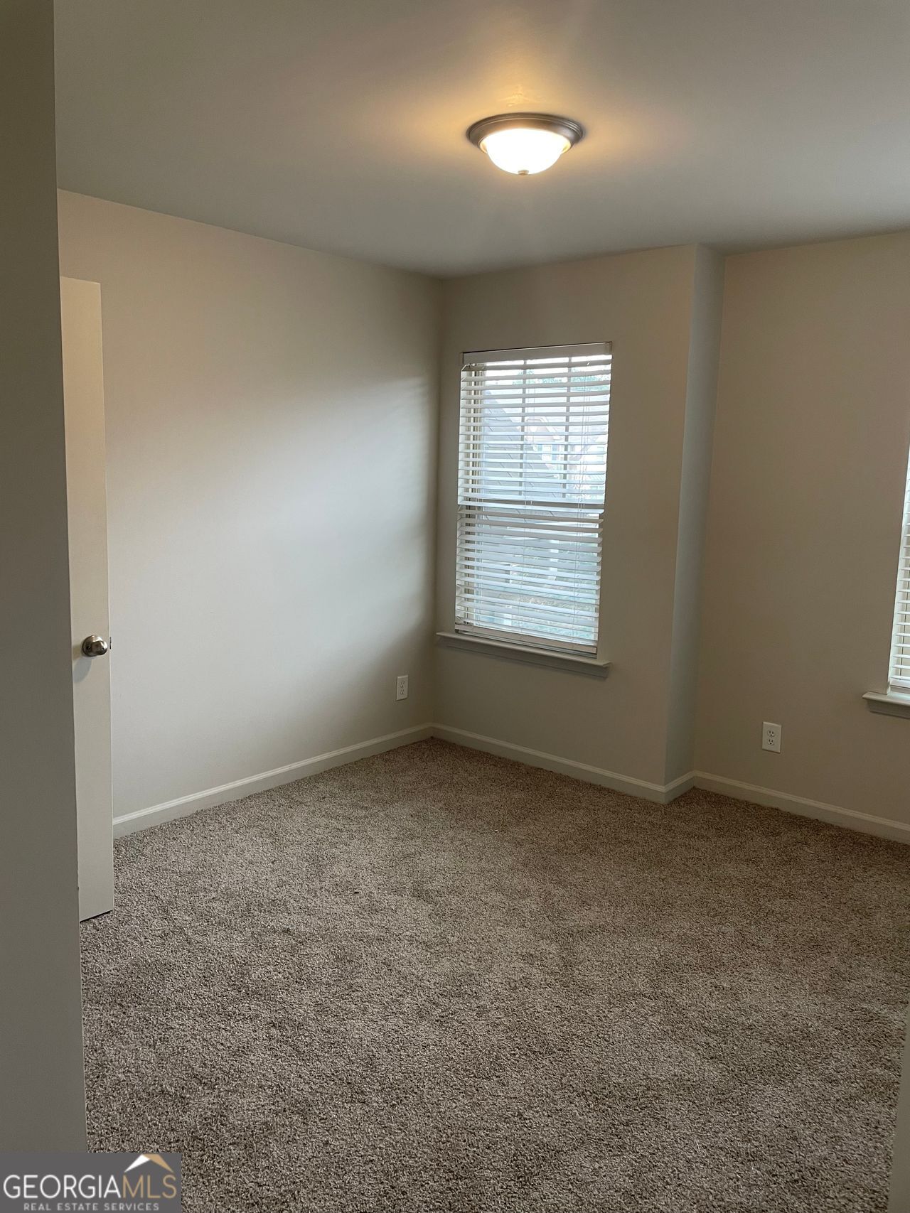 3810 Equity Lane Powder Springs, GA 30127 - Photo 21 of 32 an empty room with a window