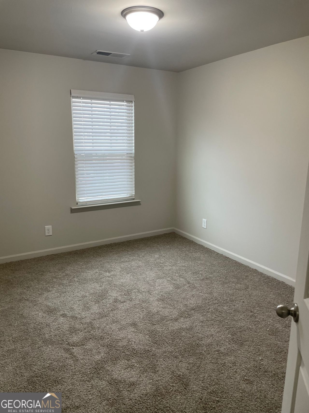 3810 Equity Lane Powder Springs, GA 30127 - Photo 22 of 32 an empty room with a window