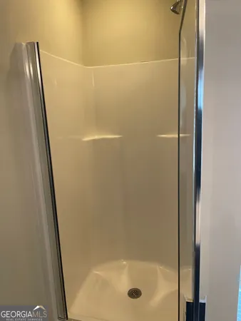 a bathroom with a sink vanity and a toilet