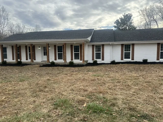a front view of a house with yard