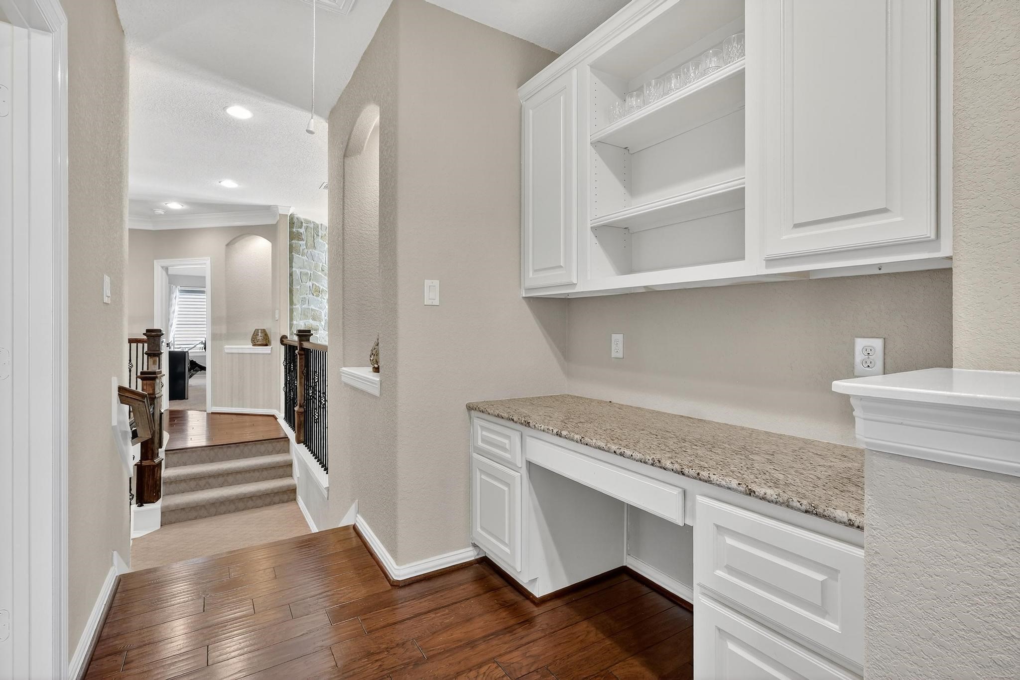 25803 Heritage Maple Drive Spring, TX 77389 - Photo 21 of 46 a view of a hallway with wooden floor and staircase