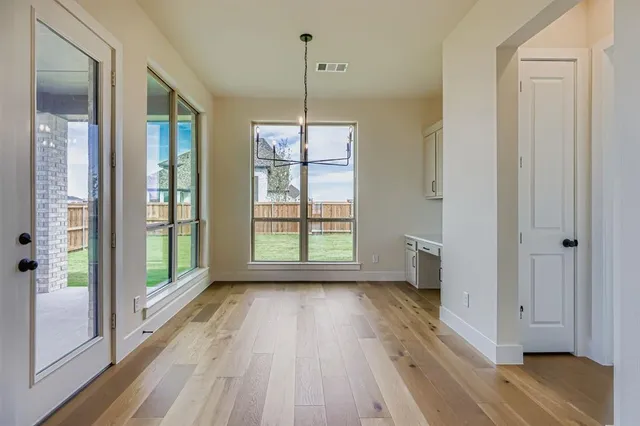 a kitchen with kitchen island a sink stainless steel appliances and cabinets