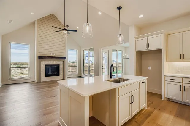 a view of a house with a backyard and porch