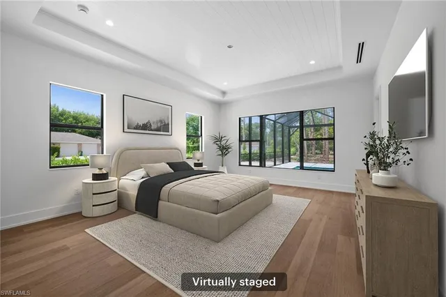 a spacious bathroom with sink bathtub and window
