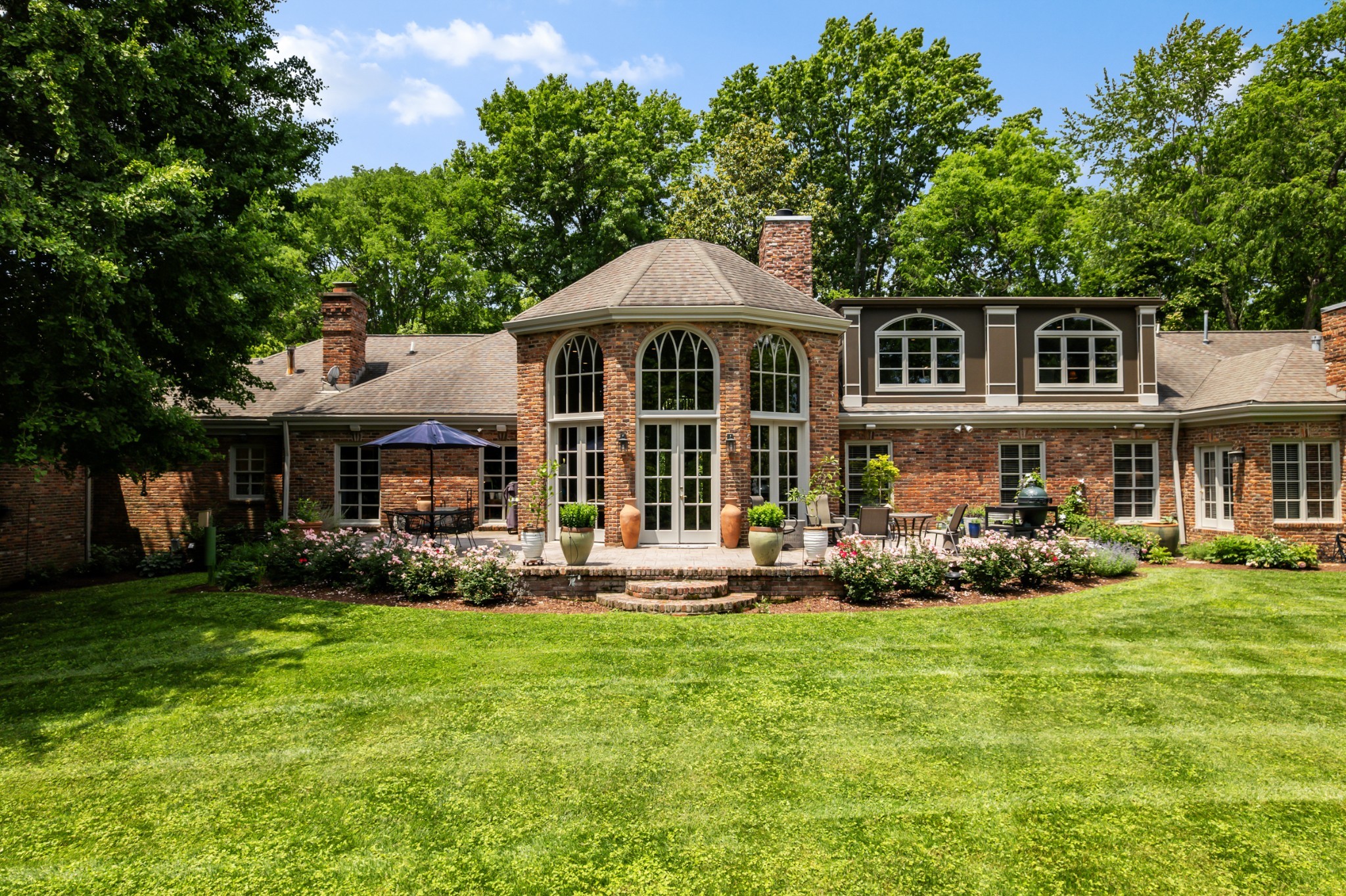140 Brook Hollow Road Nashville, TN 37205 - Photo 27 of 31 a front view of a house with a garden and porch