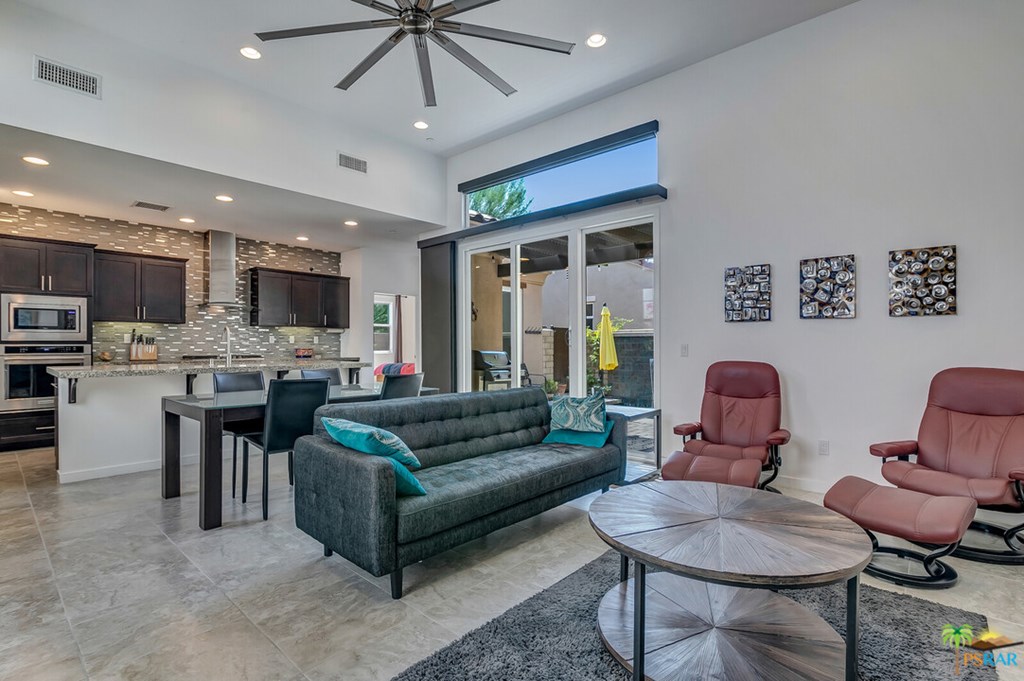 460 Limestone Palm Springs, CA 92262 - Photo 1 of 1 a living room with furniture kitchen view and a chandelier