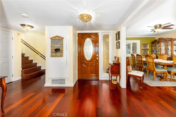 a living room with furniture rug and lamp