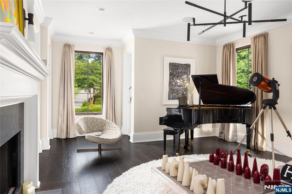 7-11 Stokes Farm Road Old Tappan, NJ 07675 - Photo 11 of 40 a living room with furniture and a fireplace