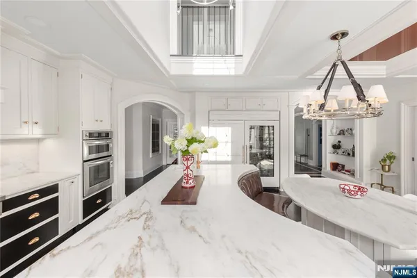 a kitchen with a sink cabinets and window