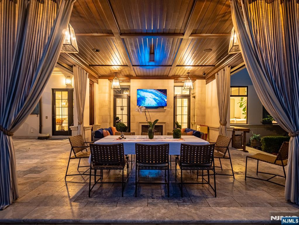 7-11 Stokes Farm Road Old Tappan, NJ 07675 - Photo 39 of 40 a view of a dining room with furniture window and wooden floor
