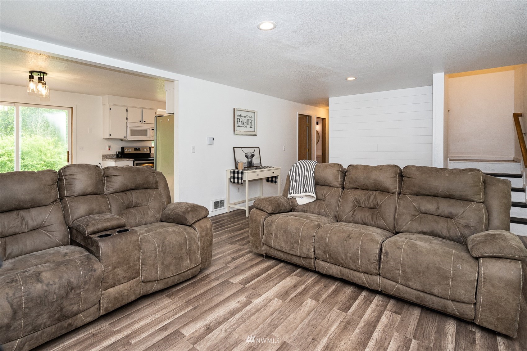 181 Crego Ridge Road Chehalis, WA 98532 - Photo 3 of 33 a living room with couches and kitchen view with wooden floor