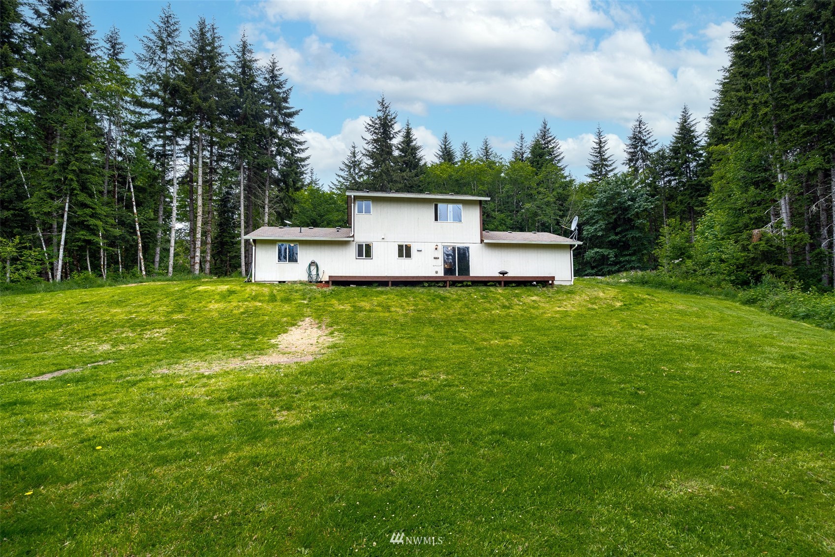 181 Crego Ridge Road Chehalis, WA 98532 - Photo 31 of 33 a house view with a sitting space and garden