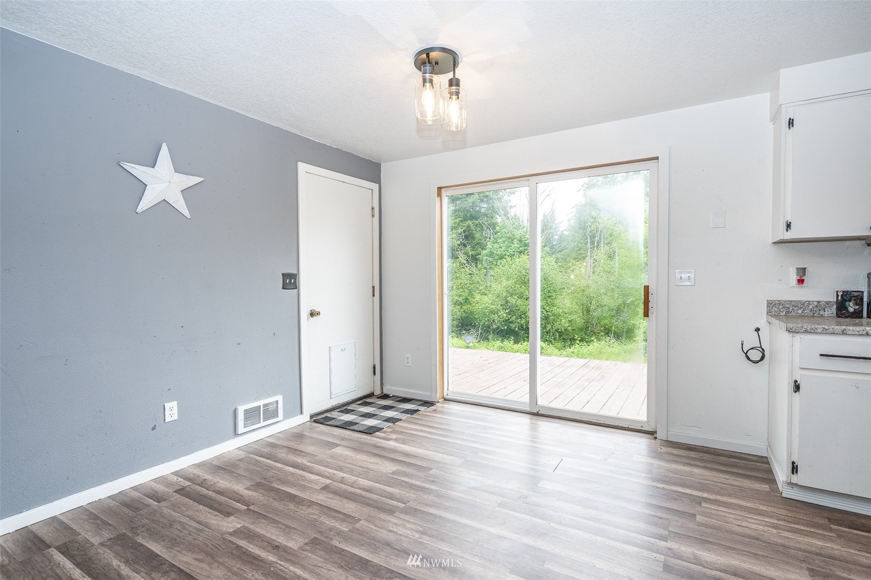 181 Crego Ridge Road Chehalis, WA 98532 - Photo 4 of 33 a view of an empty room with wooden floor and a window
