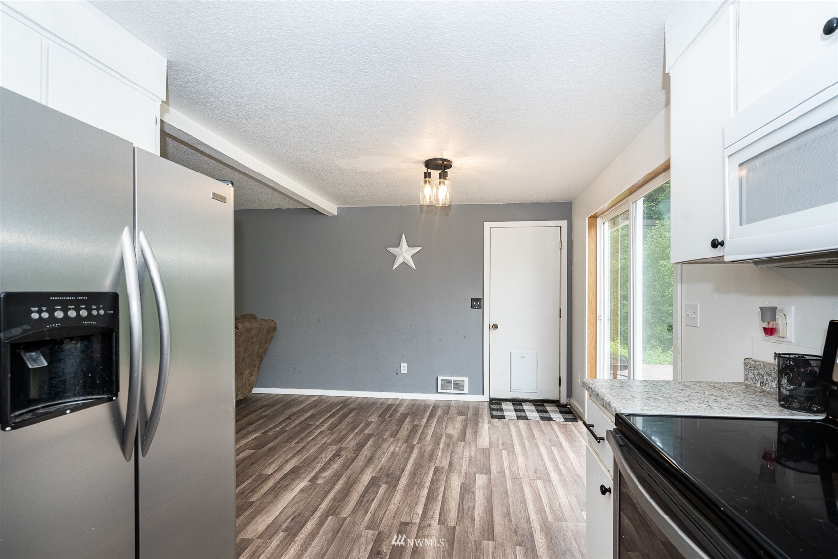 181 Crego Ridge Road Chehalis, WA 98532 - Photo 6 of 33 a kitchen with stainless steel appliances granite countertop a refrigerator and a sink
